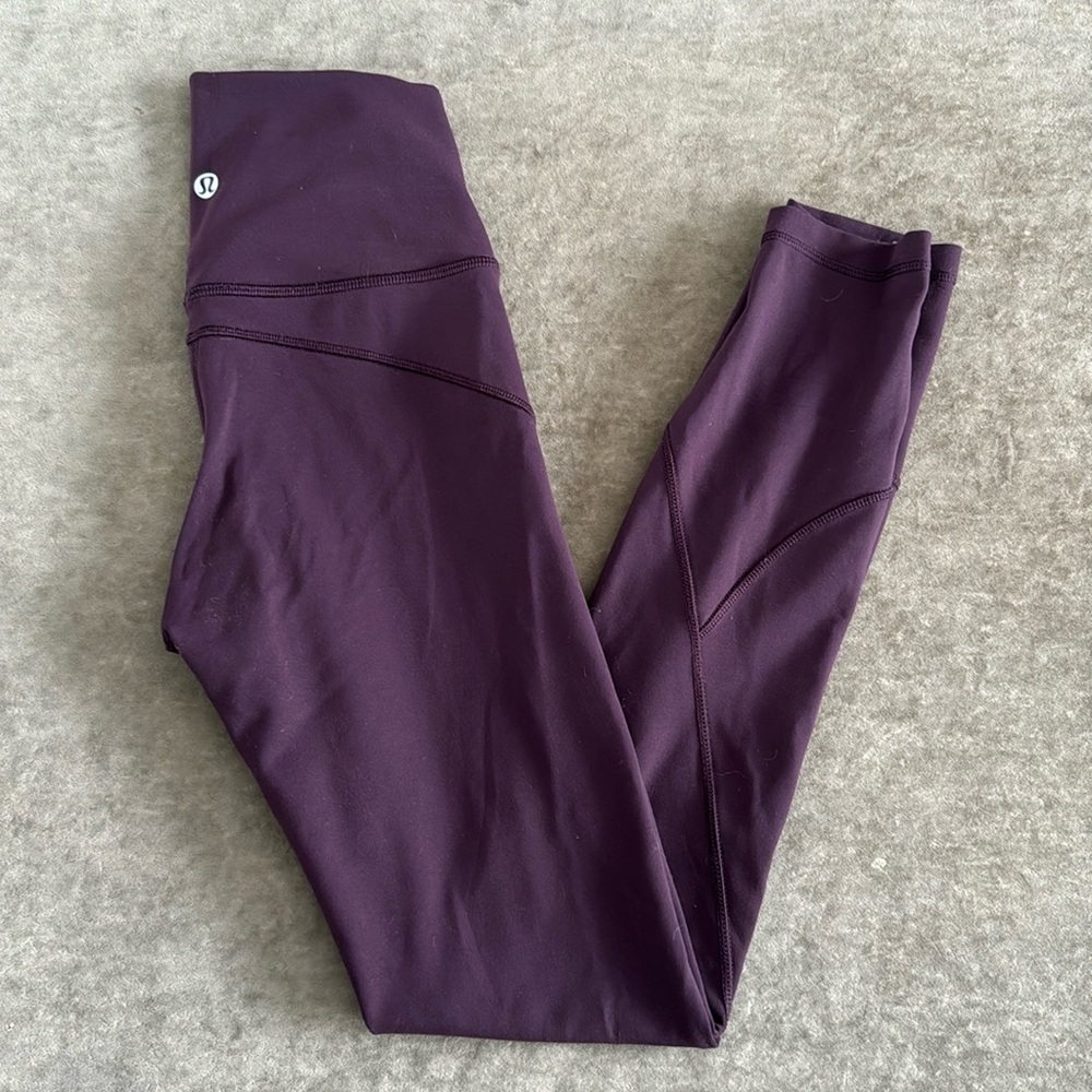 Lululemon In Movement tight. Inseam 25 inches. Color- eggplant. Size- 2